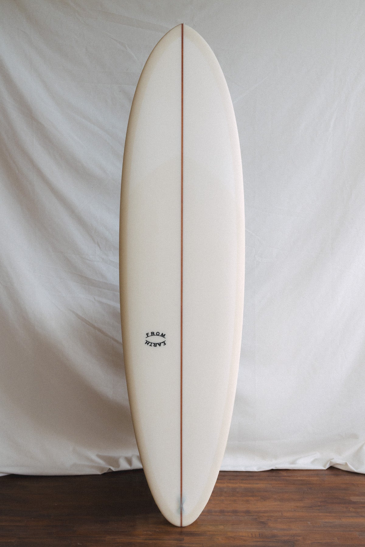 midlength twin fin surfboard by from earth for sale in bali